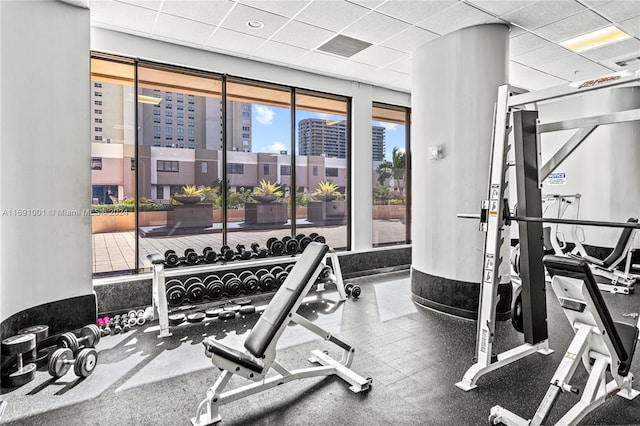 gym featuring a paneled ceiling