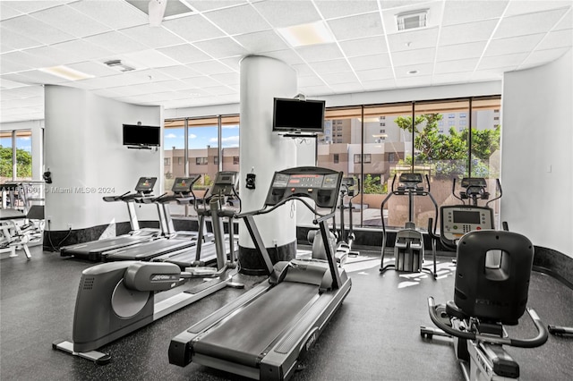 workout area with a drop ceiling