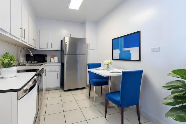 20225 NE 34th Ct Unit 1711, Aventura, FL 33180 - kitchen featuring freestanding refrigerator, white dishwasher, white cabinetry, and light countertops