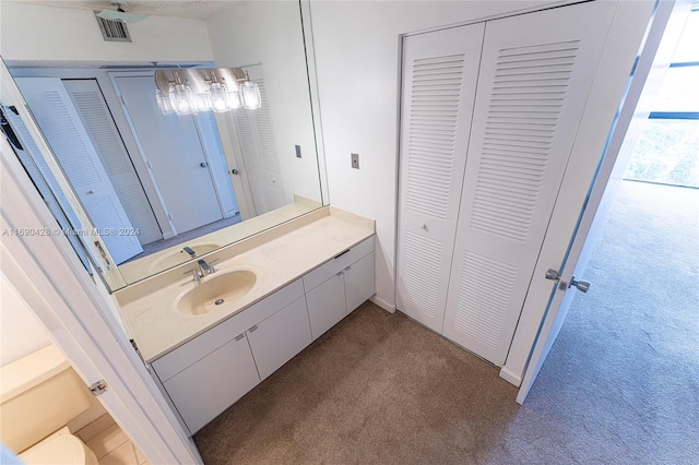 20225 NE 34th Ct Unit 1711, Aventura, FL 33180 - bathroom with a closet, vanity, and carpet flooring