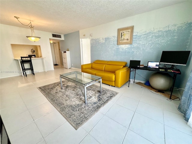 tiled living room with a textured ceiling