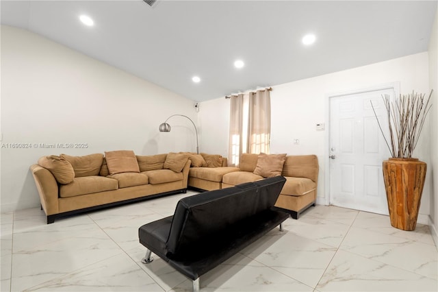 living room featuring lofted ceiling