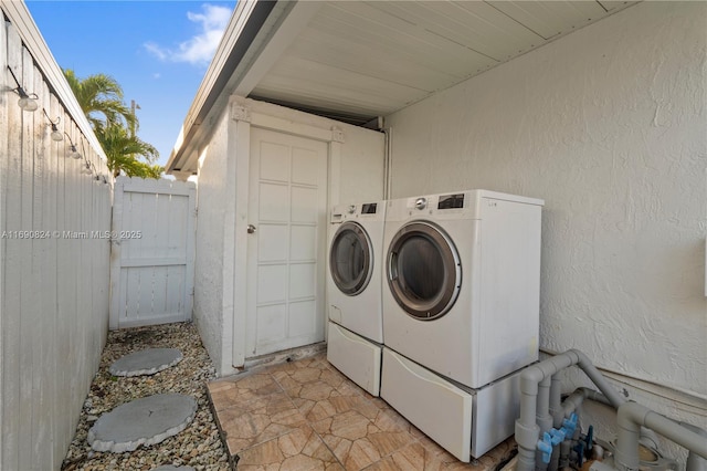 laundry room featuring washer and clothes dryer