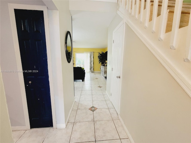 hallway featuring light tile patterned floors