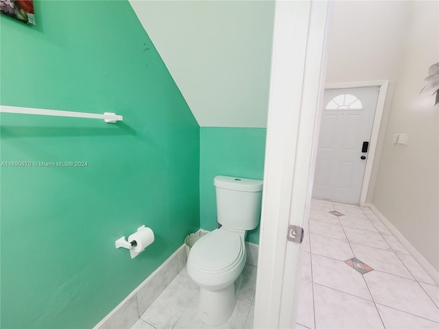 bathroom featuring tile patterned flooring and toilet