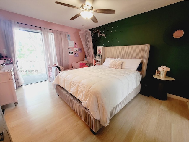 bedroom with ceiling fan, light hardwood / wood-style floors, and access to outside