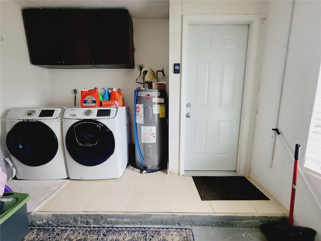 washroom with washer and clothes dryer, tile patterned flooring, cabinets, and water heater