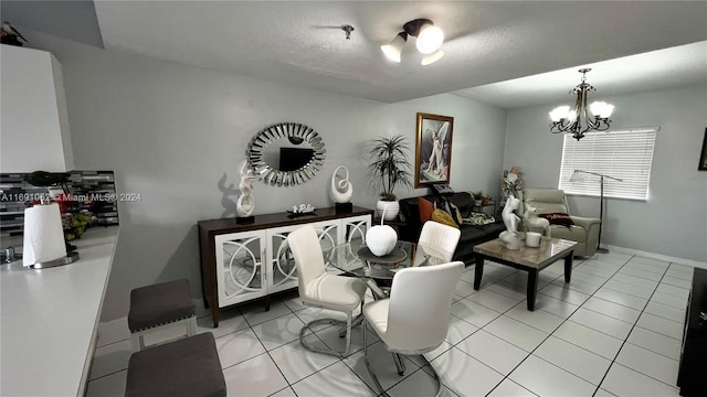 tiled dining room with an inviting chandelier