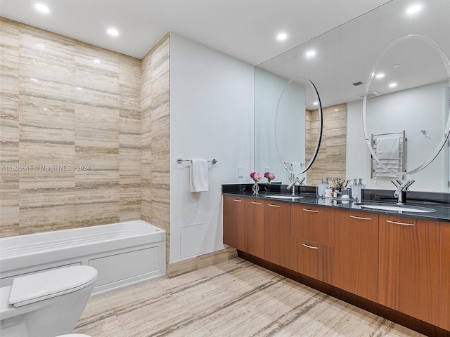 bathroom with hardwood / wood-style flooring, vanity, and toilet