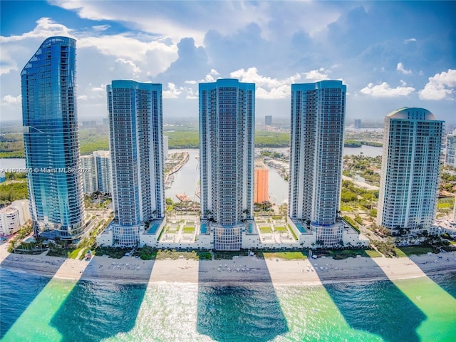 city view featuring a water view and a beach view