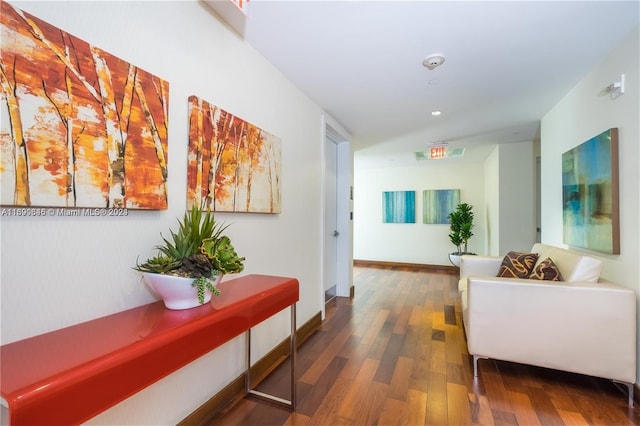 hall with dark hardwood / wood-style flooring