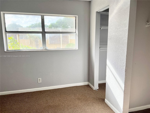 unfurnished bedroom featuring carpet