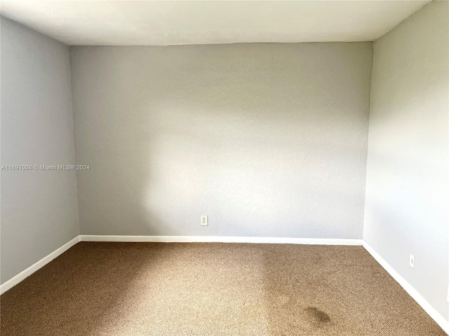 spare room featuring carpet flooring