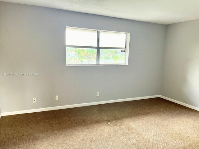 unfurnished room with carpet flooring