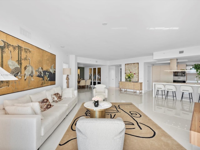 living room with light tile patterned flooring