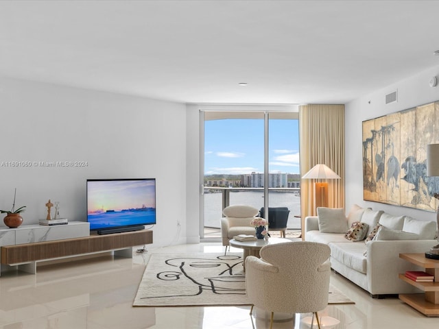 living room with floor to ceiling windows