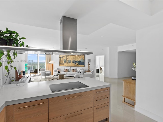 kitchen featuring black electric stovetop and light tile patterned floors