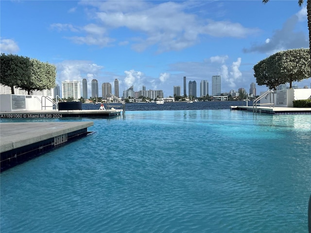 view of swimming pool with a water view