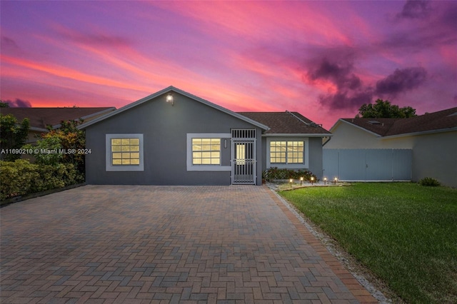 ranch-style house with a yard