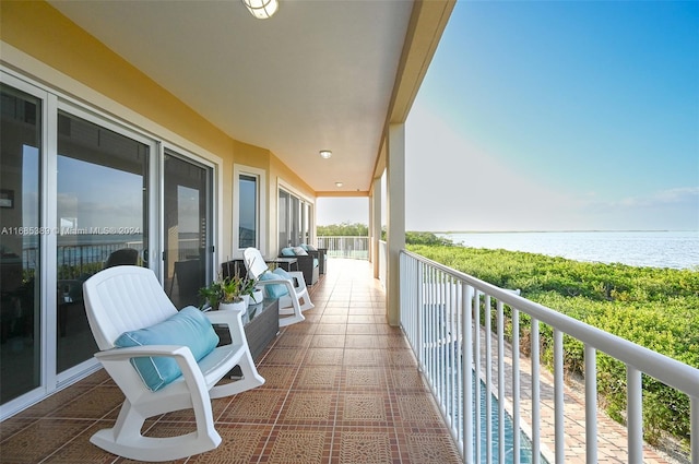 balcony featuring a water view