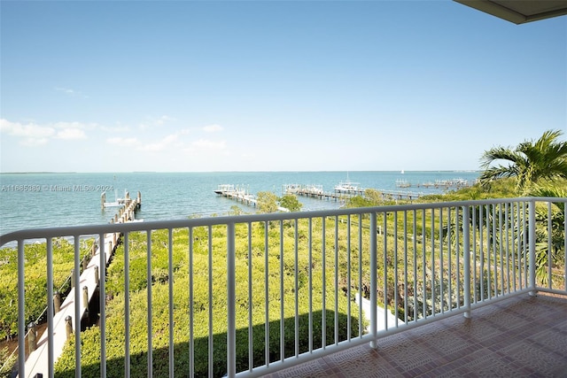 balcony featuring a water view