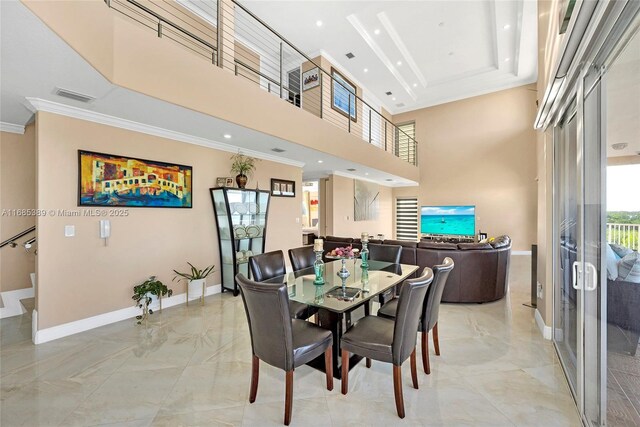 kitchen featuring white cabinetry, appliances with stainless steel finishes, light stone countertops, backsplash, and crown molding