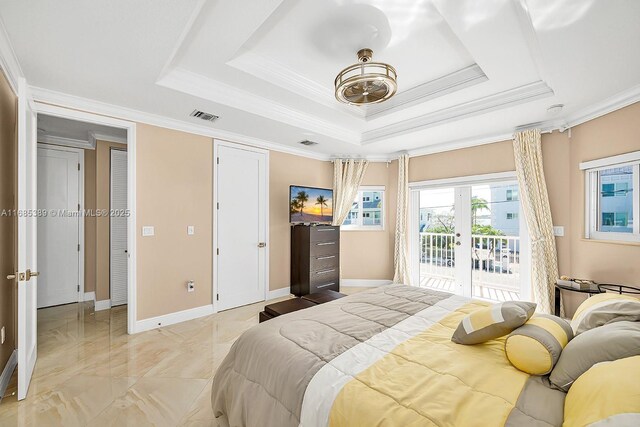 bedroom featuring ornamental molding, access to outside, and a tray ceiling