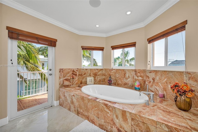 bathroom featuring a wealth of natural light, ornamental molding, and tiled tub