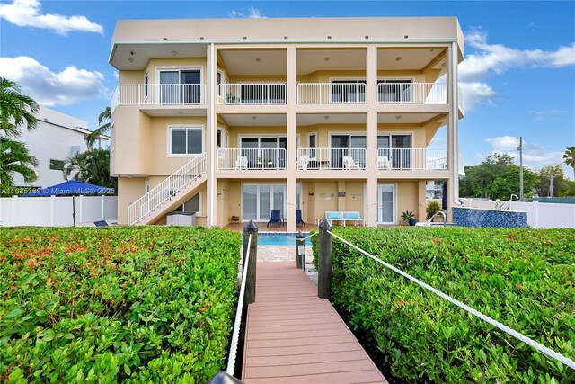 balcony featuring a water view