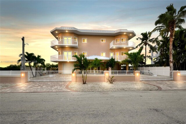 view of front of home featuring a balcony