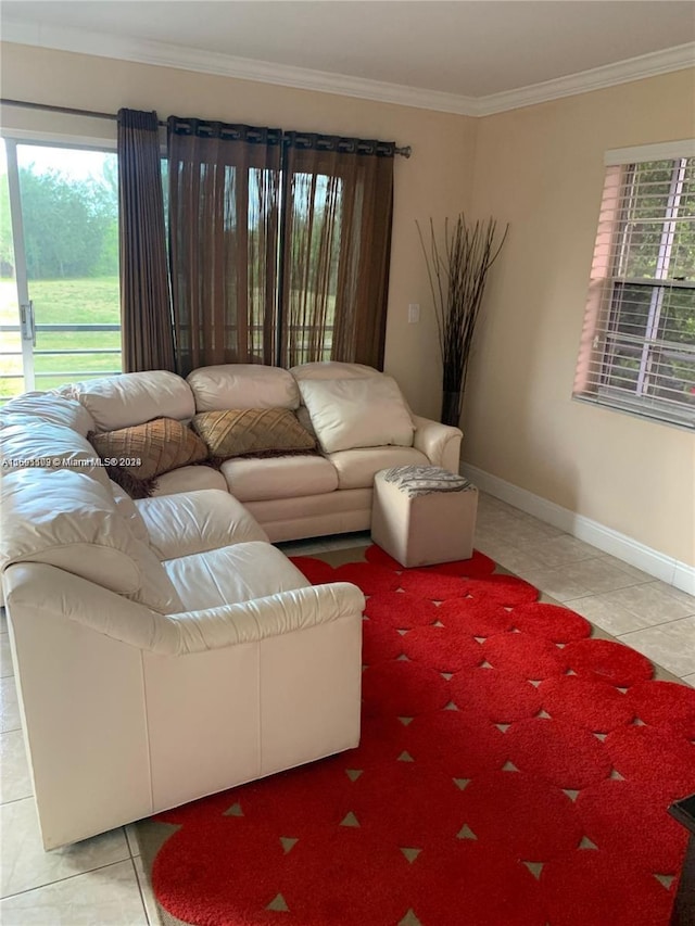 living room featuring a wealth of natural light, tile patterned flooring, and crown molding