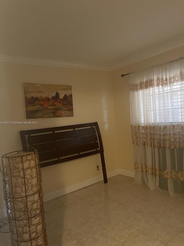 tiled bedroom featuring crown molding