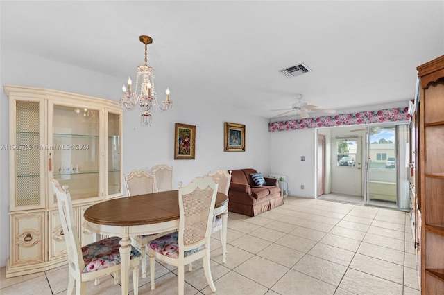 dining area featuring ceiling fan with notable chandelier and light tile patterned flooring