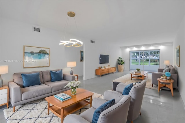 living room featuring a notable chandelier