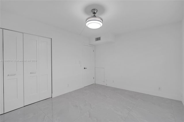 unfurnished bedroom with a closet