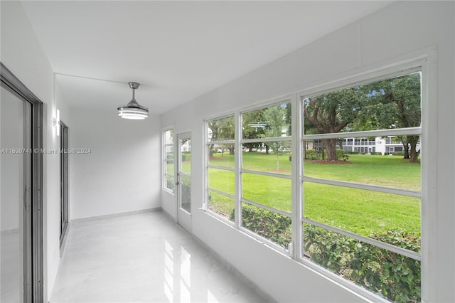 unfurnished sunroom with a healthy amount of sunlight