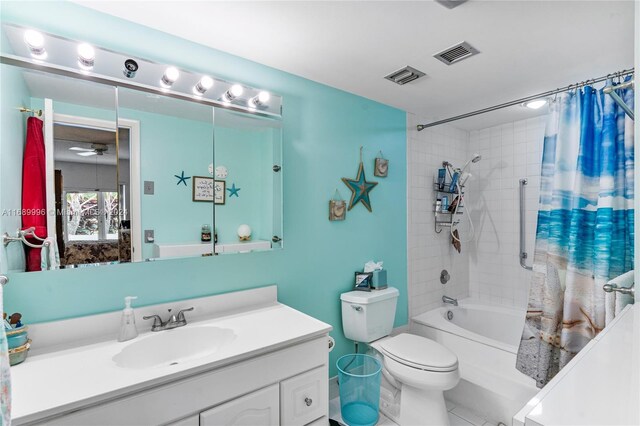 full bathroom featuring ceiling fan, tile patterned flooring, toilet, vanity, and shower / tub combo