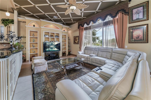 tiled living room with ceiling fan, ornamental molding, and coffered ceiling