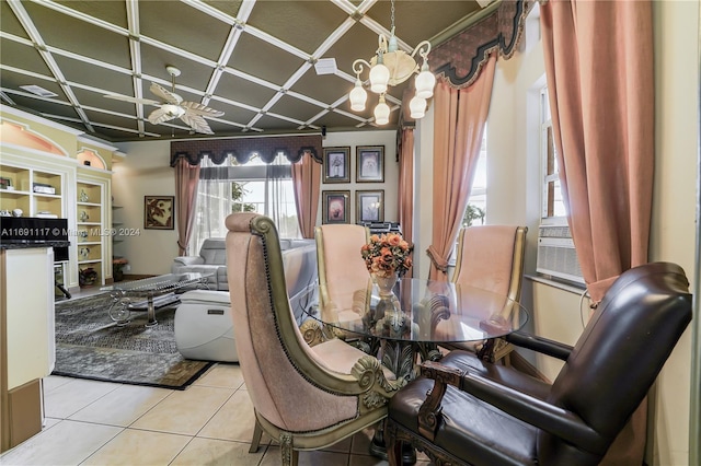 dining space with ceiling fan with notable chandelier and light tile patterned flooring