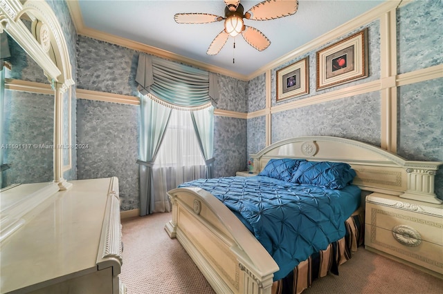 carpeted bedroom featuring ceiling fan and crown molding