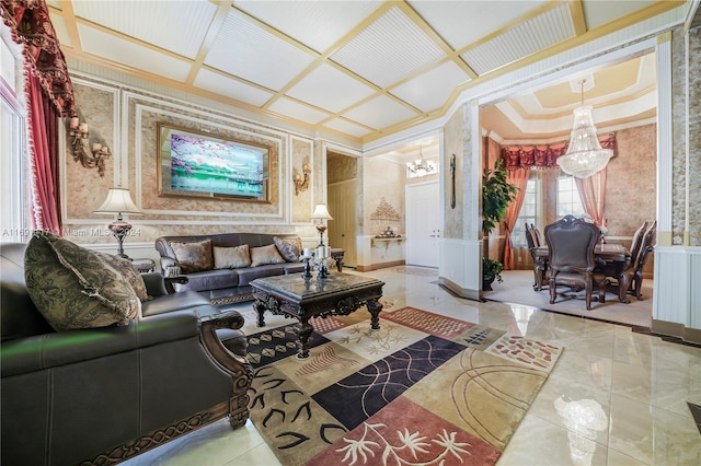 174 NW Magnolia Lakes Blvd, Port St Lucie, FL 34986 - living room featuring a chandelier, ornamental molding, a wainscoted wall, marble finish floors, and a decorative wall