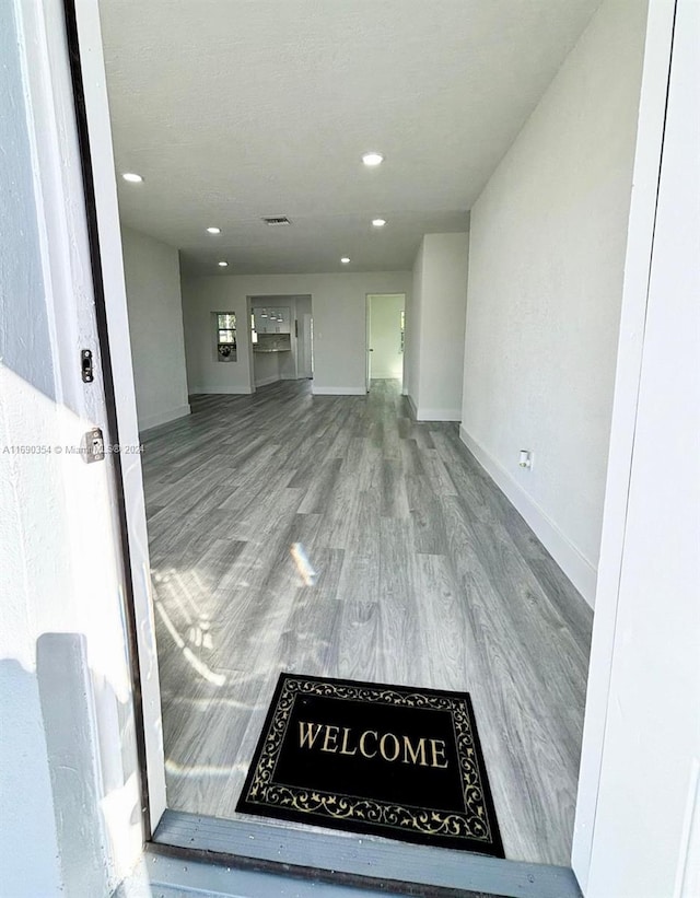 unfurnished living room featuring hardwood / wood-style flooring