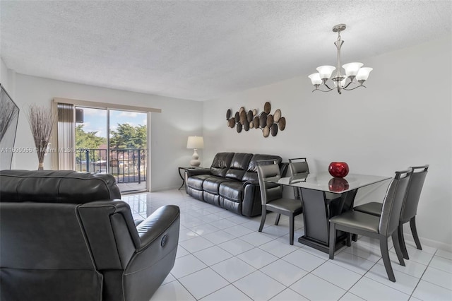 living room featuring a textured ceiling, a chandelier, and light tile patterned flooring