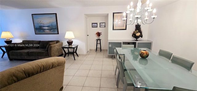 dining room with light tile patterned floors and an inviting chandelier