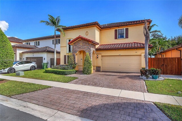 back of property with a gazebo, an in ground hot tub, and a patio area