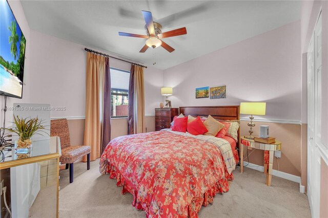 carpeted bedroom featuring ceiling fan