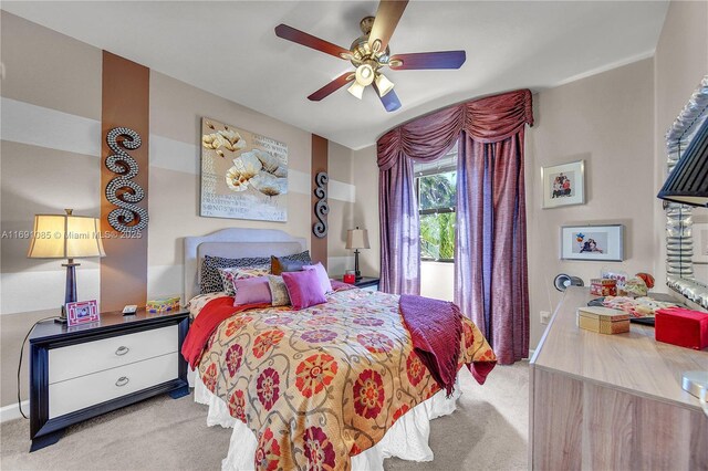 bedroom with light carpet and ceiling fan