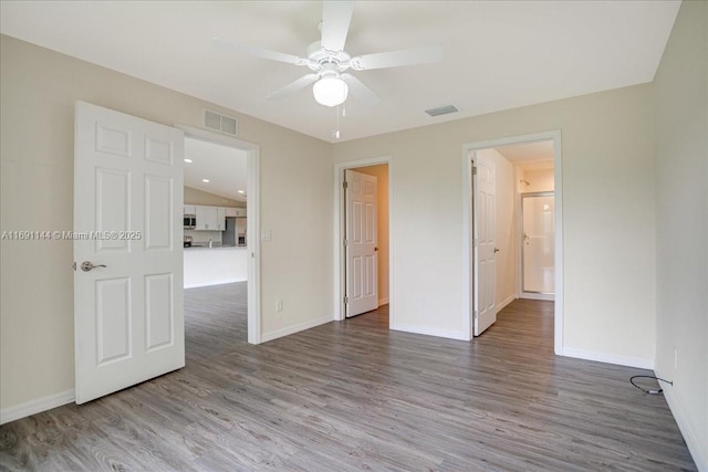 unfurnished room featuring hardwood / wood-style flooring and ceiling fan