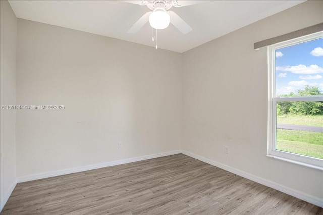 unfurnished room featuring ceiling fan, a healthy amount of sunlight, and light hardwood / wood-style floors