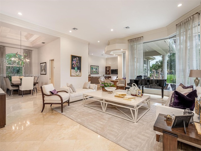 living room featuring ornamental molding and a notable chandelier